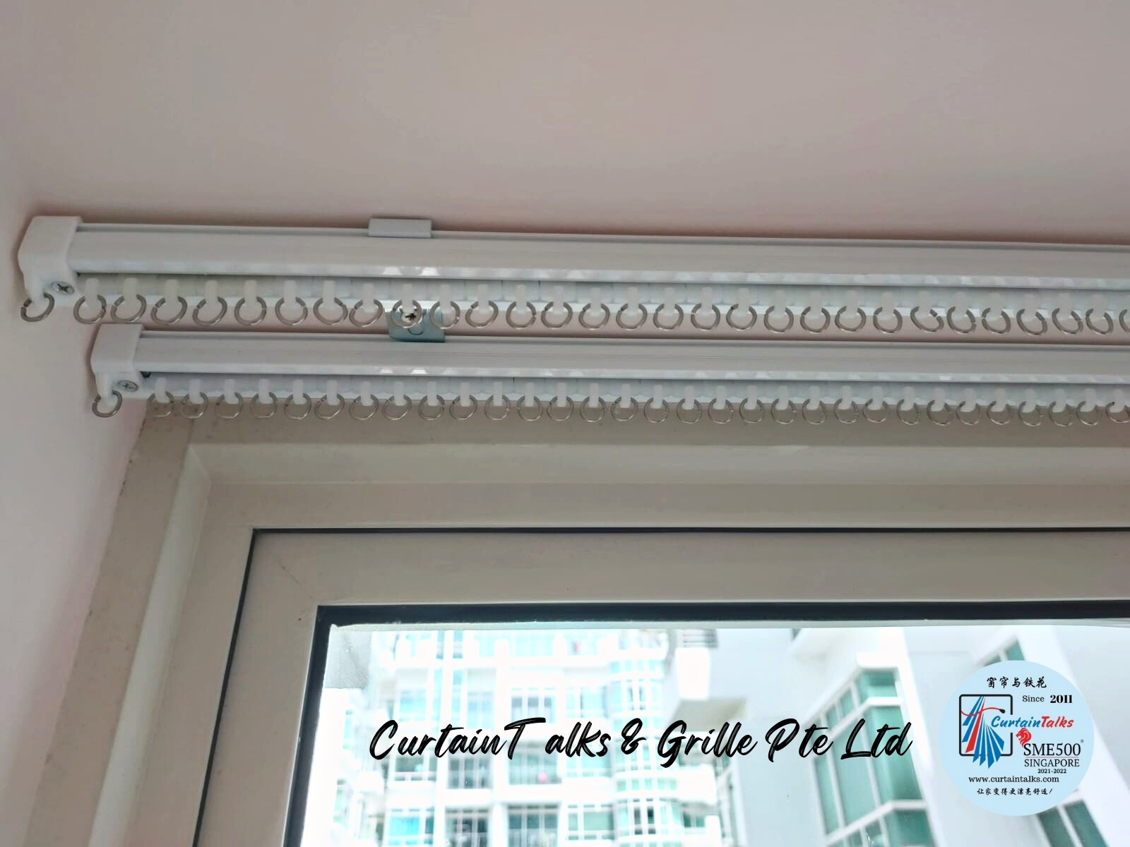 This is a Picture of Double ceiling mounted white curtain track installed at 945 Bukit Timah Road